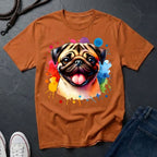 Brown t-shirt with a colorful pug design on a dark surface