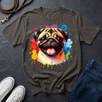 Gray t-shirt with a colorful pug design on a dark surface with shoes and jeans.
