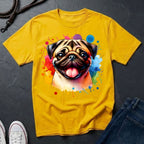 Yellow t-shirt with a colorful pug design on a dark surface
