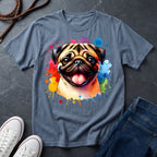 Gray t-shirt with a colorful pug design on a dark surface with shoes and jeans.