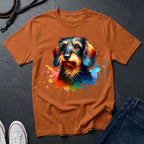 Brown t-shirt with a colorful dog graphic on a dark surface
