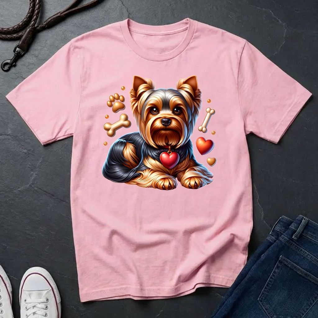 Pink t-shirt with a dog graphic on a dark surface