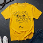 Yellow t-shirt with a pug graphic and 'Pug' text on a dark surface.