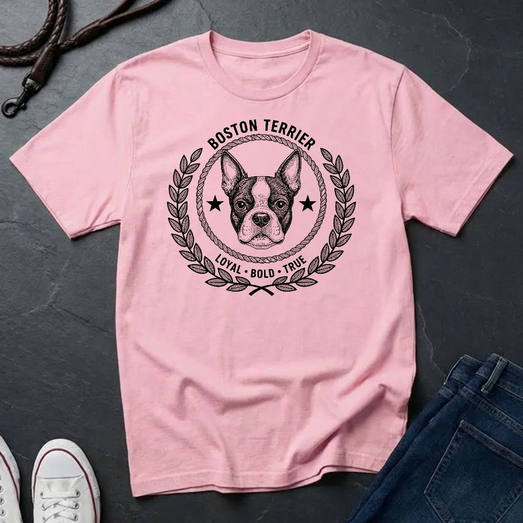 Pink Comfort Colors t-shirt with Boston Terrier graphic and text on a dark surface