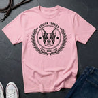 Pink Comfort Colors t-shirt with Boston Terrier graphic and text on a dark surface