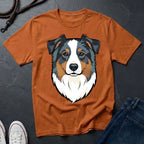 Brown Comfort Colors t-shirt with a dog graphic on a dark surface