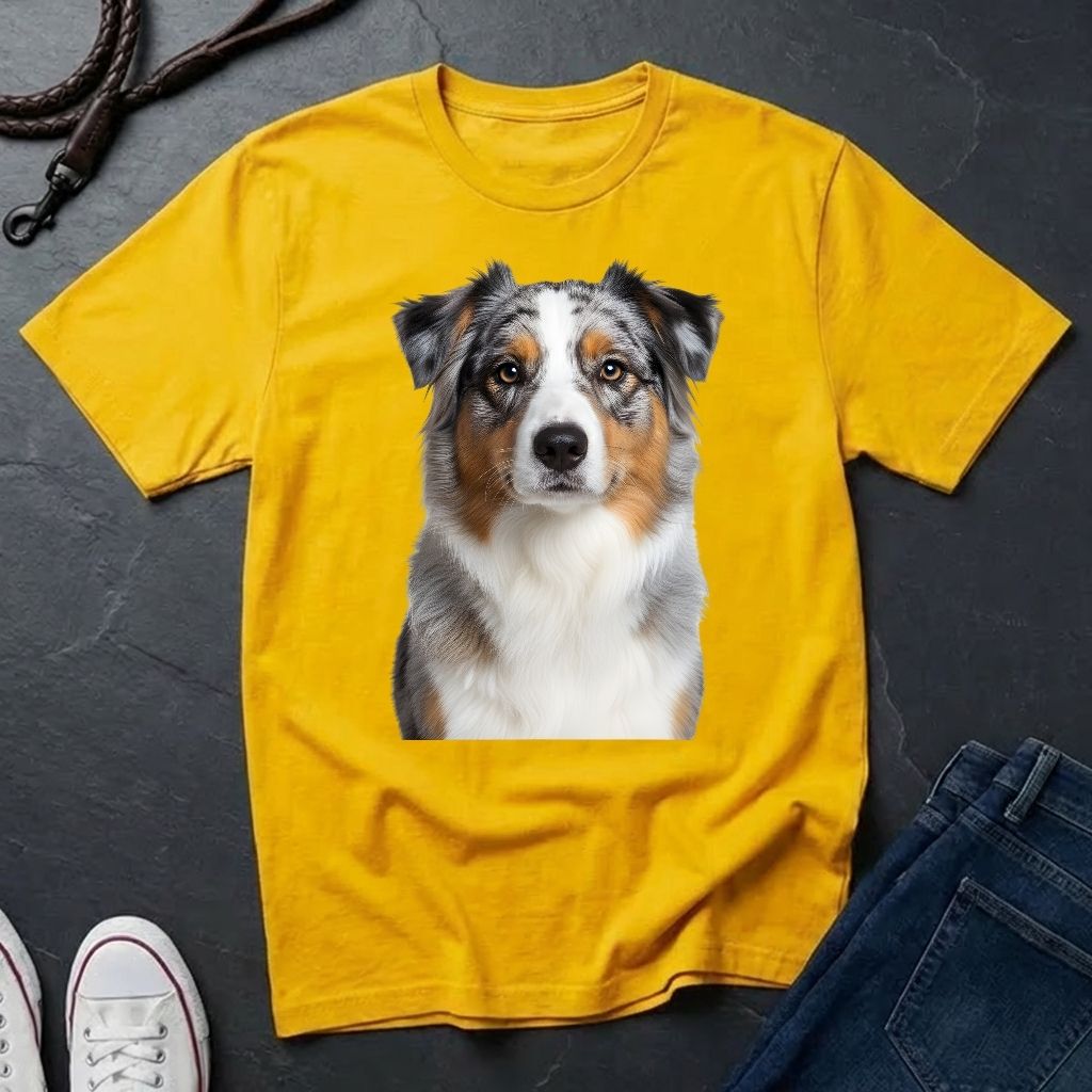 Yellow Comfort Colors t-shirt with a dog graphic on a dark surface with shoes and jeans.