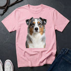 Pink Comfort Colors t-shirt with a dog graphic on a dark surface