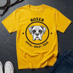 Yellow Comfort Colors t-shirt with boxer dog graphic and text on a dark surface