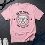 Pink Comfort Colors t-shirt with English Bulldog graphic and text on a dark surface