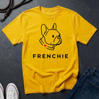 Yellow Comfort Colors t-shirt with a dog graphic and 'FRENCHIE' text on a dark surface.