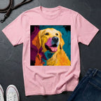Pink Comfort Colors t-shirt with a colorful dog graphic on a dark surface with shoes and jeans.