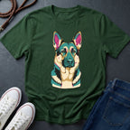 Green Comfort Colors t-shirt with a colorful dog graphic on a dark surface with shoes and jeans.