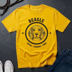 Yellow Comfort Colors t-shirt with beagle graphic and text on a dark surface