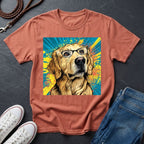 Brown Comfort Colors t-shirt with a colorful dog graphic on a dark surface with shoes and jeans.