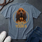 Blue Comfort Colors t-shirt with a dog graphic and 'Got Your 6' text on a dark surface with shoes and jeans.