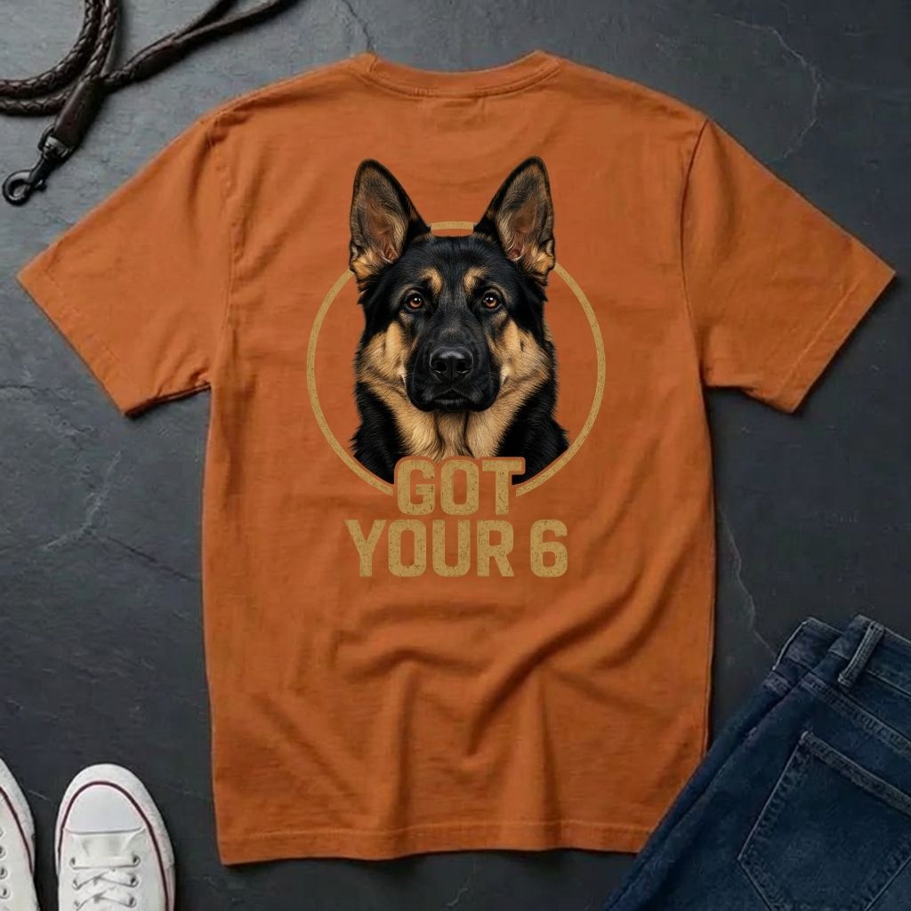 Orange Comfort Colors t-shirt with a dog graphic and 'Got Your 6' text on a dark surface.