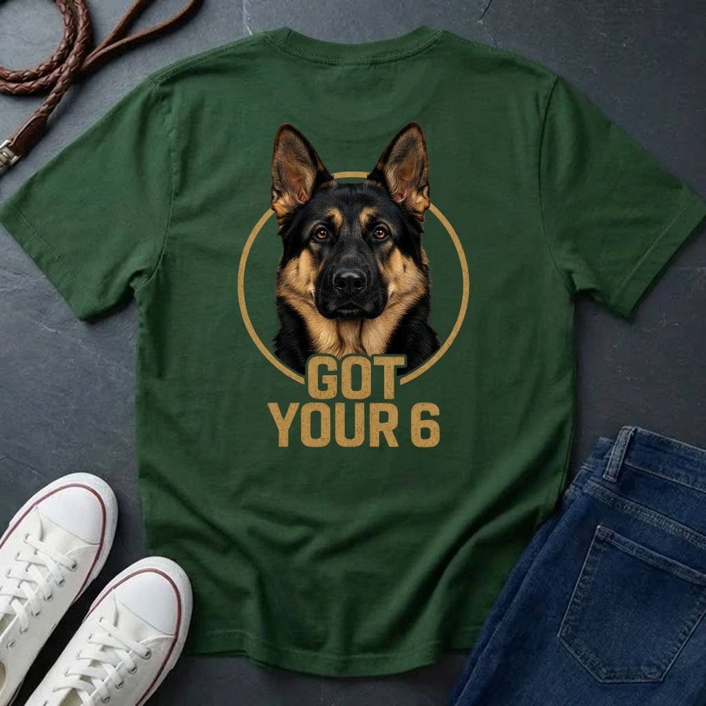 Green Comfort Colors t-shirt with a dog graphic and 'Got Your 6' text, displayed with white sneakers and blue jeans on a dark surface.