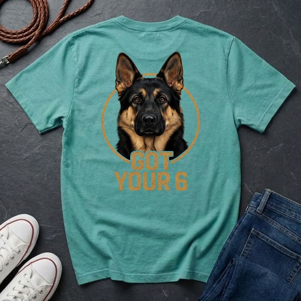 Teal Comfort Colors t-shirt with a dog graphic and 'Got Your 6' text on a dark surface with shoes and jeans.