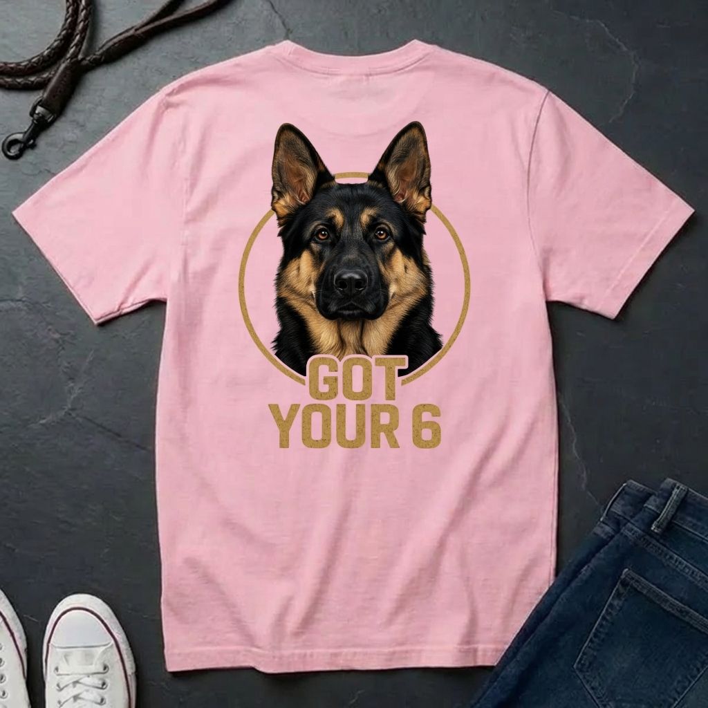 Pink Comfort Colors t-shirt with a dog graphic and 'Got Your 6' text on a dark surface.