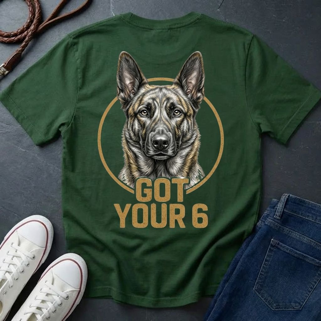 Green Comfort Colors t-shirt with a dog graphic and 'Got Your 6' text on a dark surface with shoes and jeans.