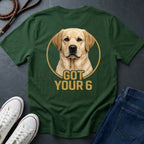 Green Comfort Colors t-shirt with a dog graphic and 'Got Your 6' text, displayed with white sneakers and blue jeans on a dark surface.