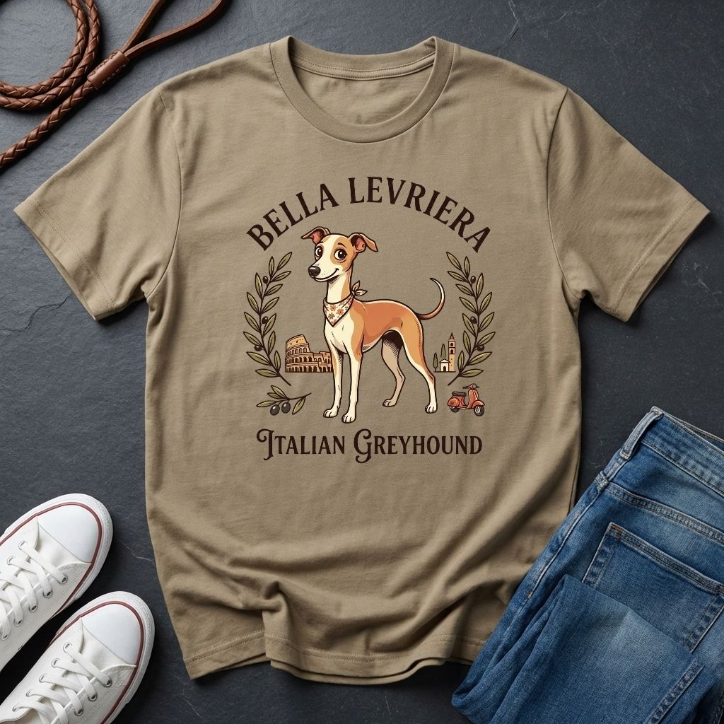 Beige Comfort Colors t-shirt with Italian Greyhound design on a dark surface with shoes and jeans.