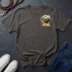 Gray Comfort Colors t-shirt with dog graphic, white sneakers, and blue jeans on a dark surface