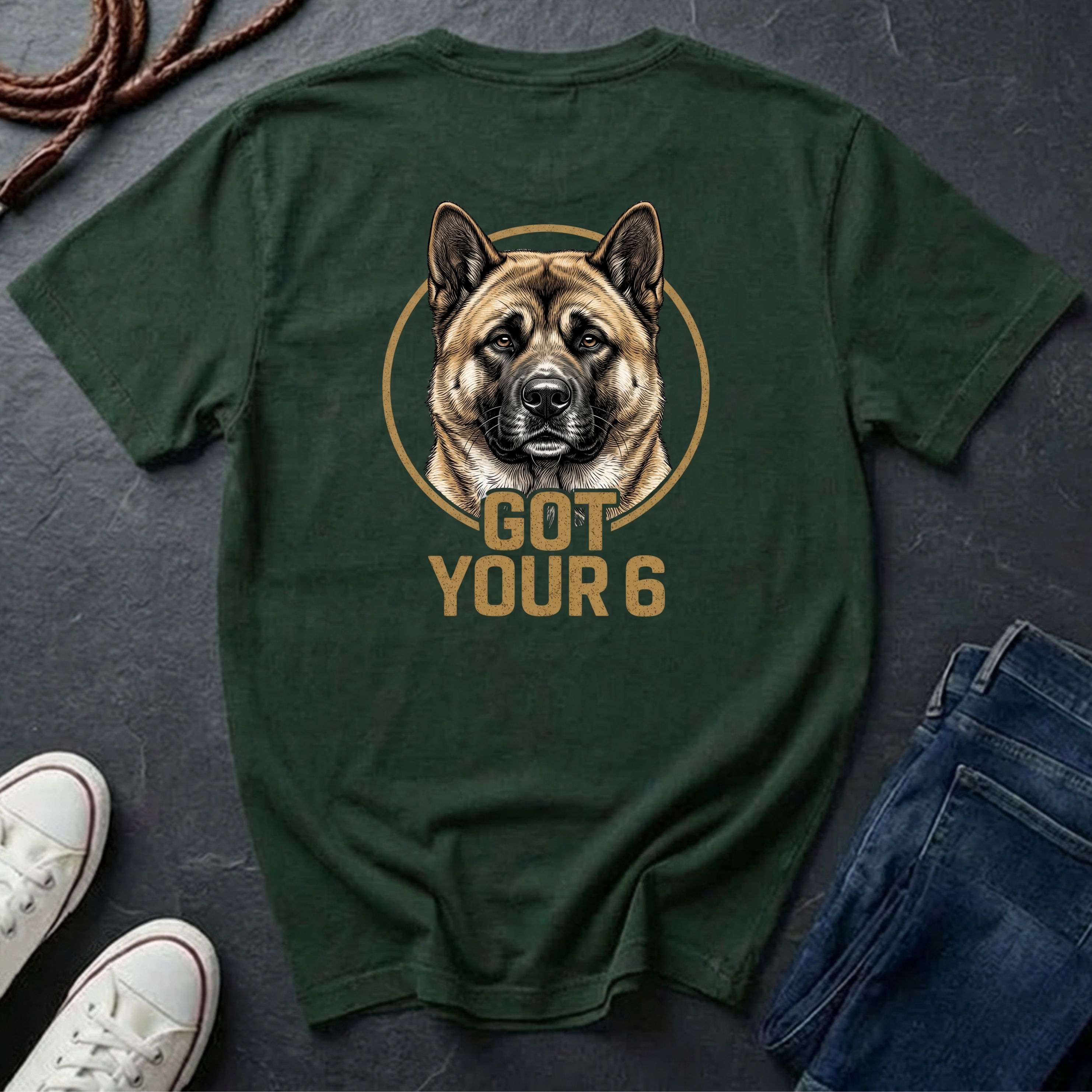 Green Comfort Colors t-shirt with a dog graphic and 'Got Your 6' text on a dark surface with shoes and jeans.