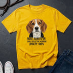 Yellow Comfort Colors t-shirt with a dog graphic and text on a dark surface