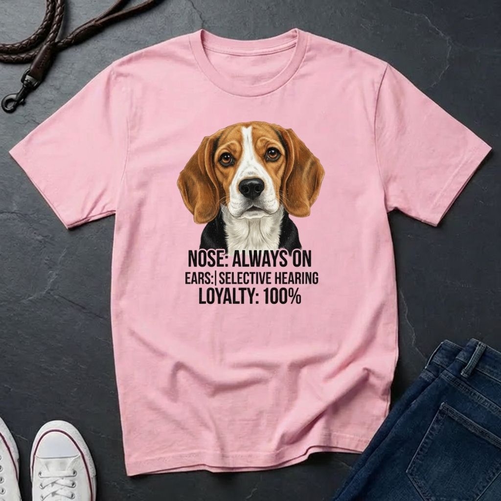 Pink Comfort Colors t-shirt with a dog graphic and text on a dark surface