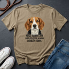 Beige Comfort Colors t-shirt with a dog graphic and text on a dark surface with shoes and jeans.