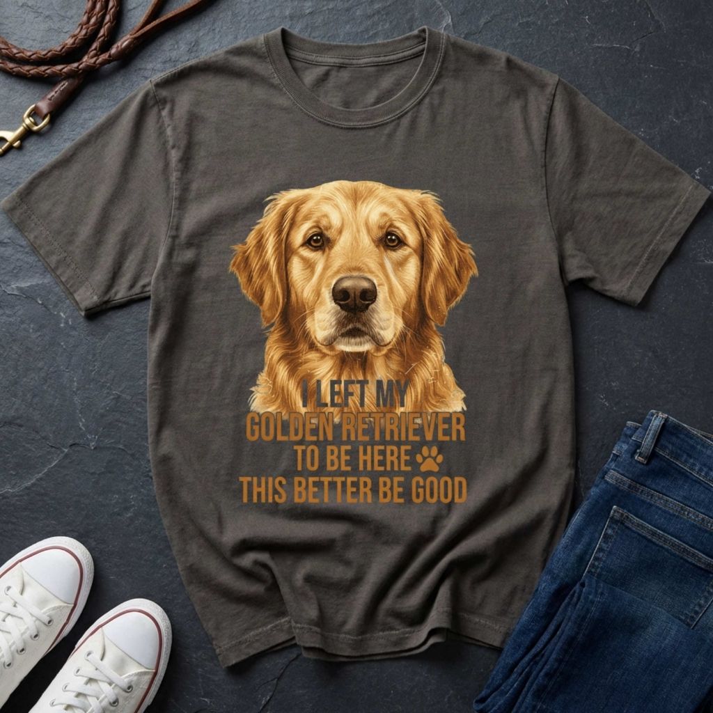 Gray Comfort Colors t-shirt with a Golden Retriever graphic and text on a dark surface with shoes and jeans.