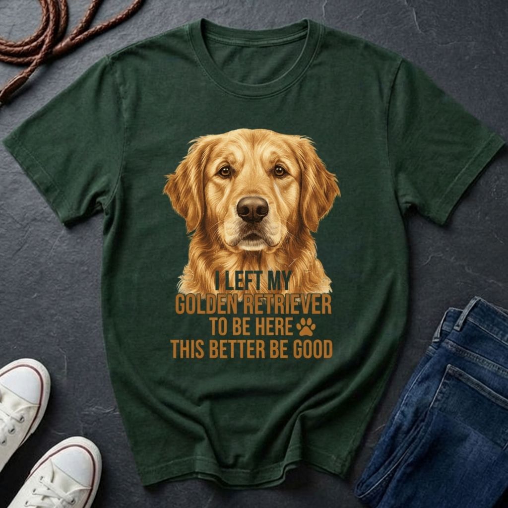Green Comfort Colors t-shirt with a golden retriever graphic and text on a dark surface with shoes and jeans.