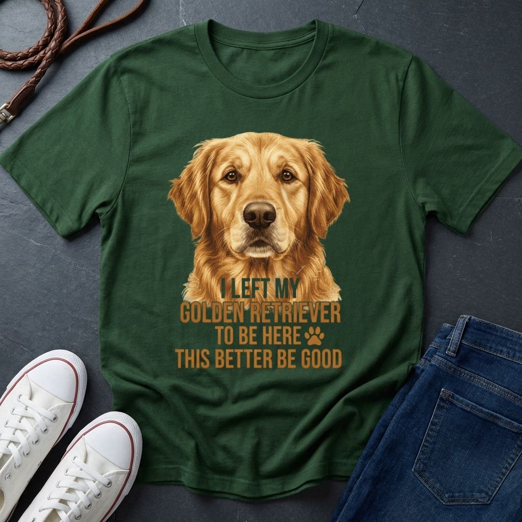 Green Comfort Colors t-shirt with a golden retriever graphic and text on a dark surface with shoes and jeans.