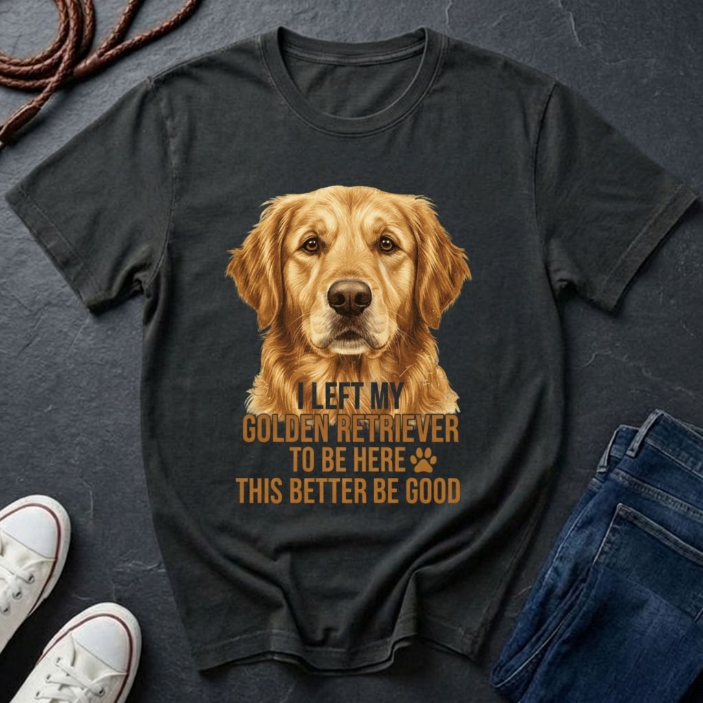 Black Comfort Colors t-shirt with a Golden Retriever graphic and text on a dark surface with shoes and jeans.