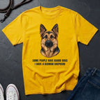 Yellow Comfort Colors t-shirt with a German Shepherd graphic and text on a dark surface.