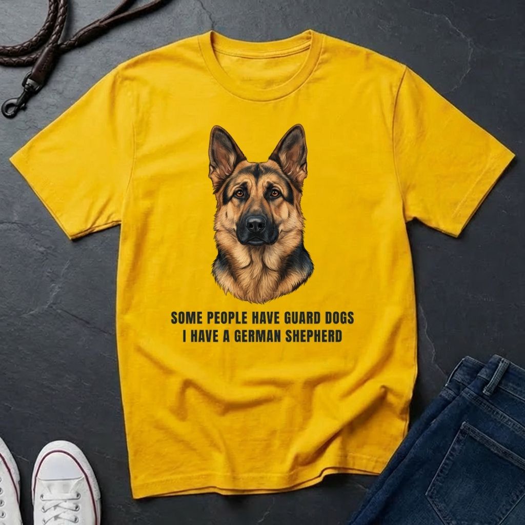 Yellow Comfort Colors t-shirt with a German Shepherd graphic and text on a dark surface.