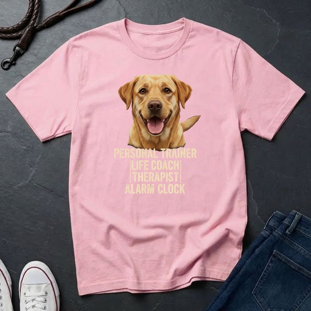 Pink Comfort Colors t-shirt with a dog graphic and text on a dark surface