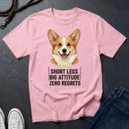 Pink Comfort Colors t-shirt with a corgi graphic and text on a dark surface