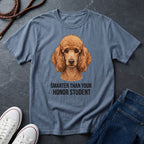 Blue Comfort Colors t-shirt with a dog graphic and text on a dark surface with shoes and jeans.