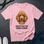 Pink Comfort Colors t-shirt with a dog illustration and text on a dark surface