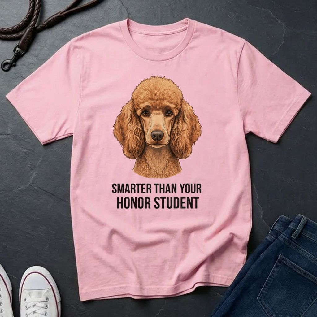 Pink Comfort Colors t-shirt with a dog illustration and text on a dark surface