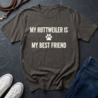 Gray Comfort Colors t-shirt with 'My Rottweiler is my best friend' text on a dark surface with shoes and jeans.