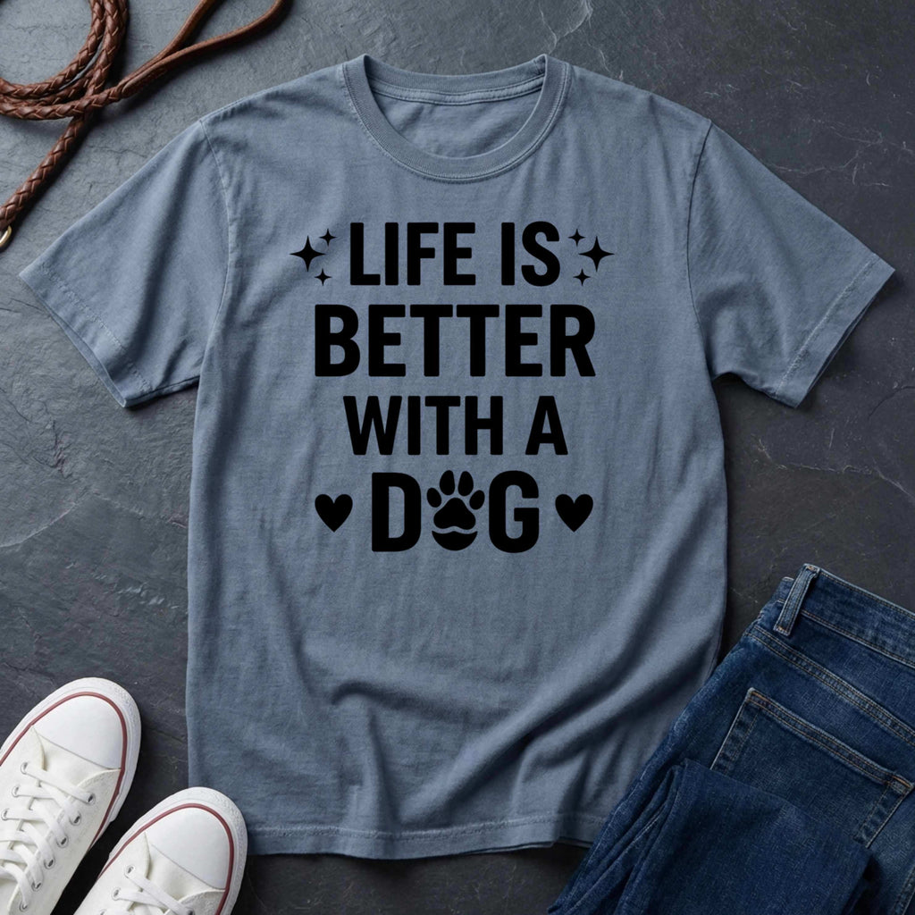 Gray Comfort Colors t-shirt with 'Life is better with a dog' text on a dark surface with shoes and jeans.