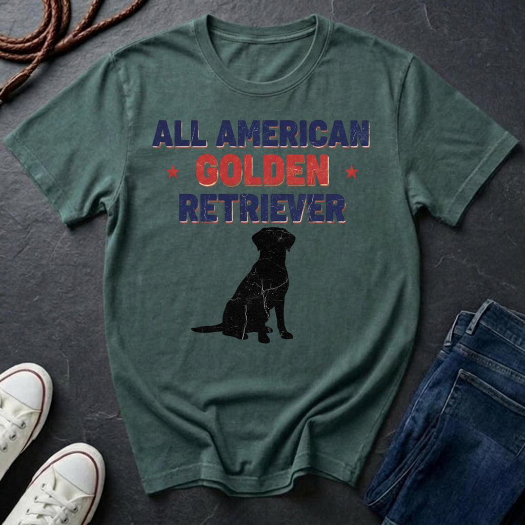 Green Comfort Colors t-shirt with 'All American Golden Retriever' text and dog silhouette on a dark surface with shoes and jeans.