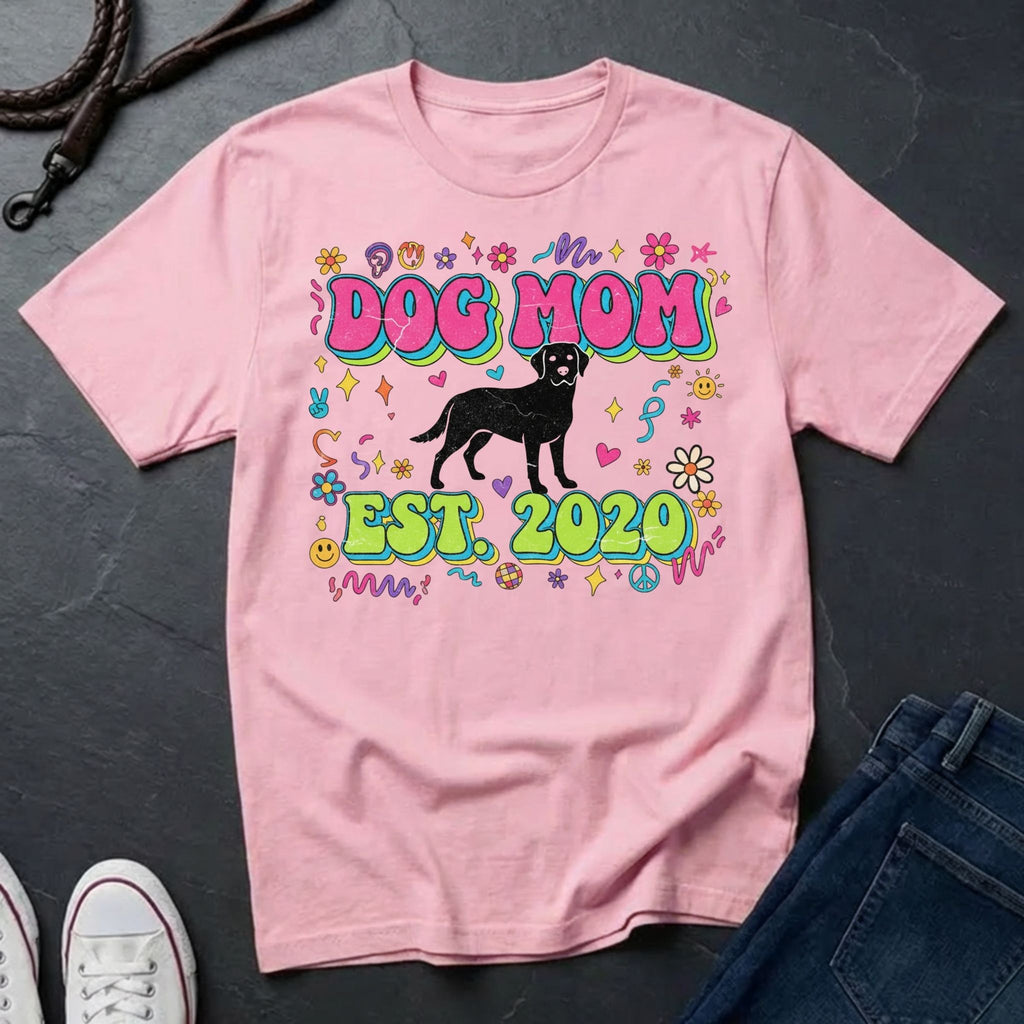 Pink Comfort Colors t-shirt with 'Dog Mom Est. 2020' design on a dark surface.