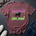 Maroon Comfort Colors t-shirt with 'Dog Mom Est. 2020' design on a dark surface with sneakers and jeans.