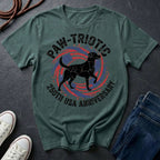 Green Comfort Colors t-shirt with a dog graphic and text on a dark surface with shoes and jeans.