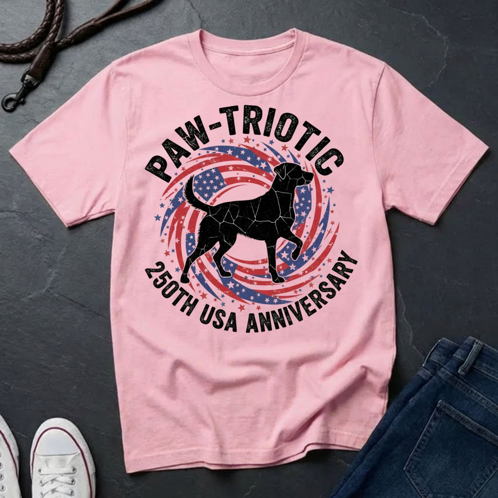 Pink Comfort Colors t-shirt with 'PAW-TRIOTIC 230th USA Anniversary' design featuring a dog silhouette on a dark surface.